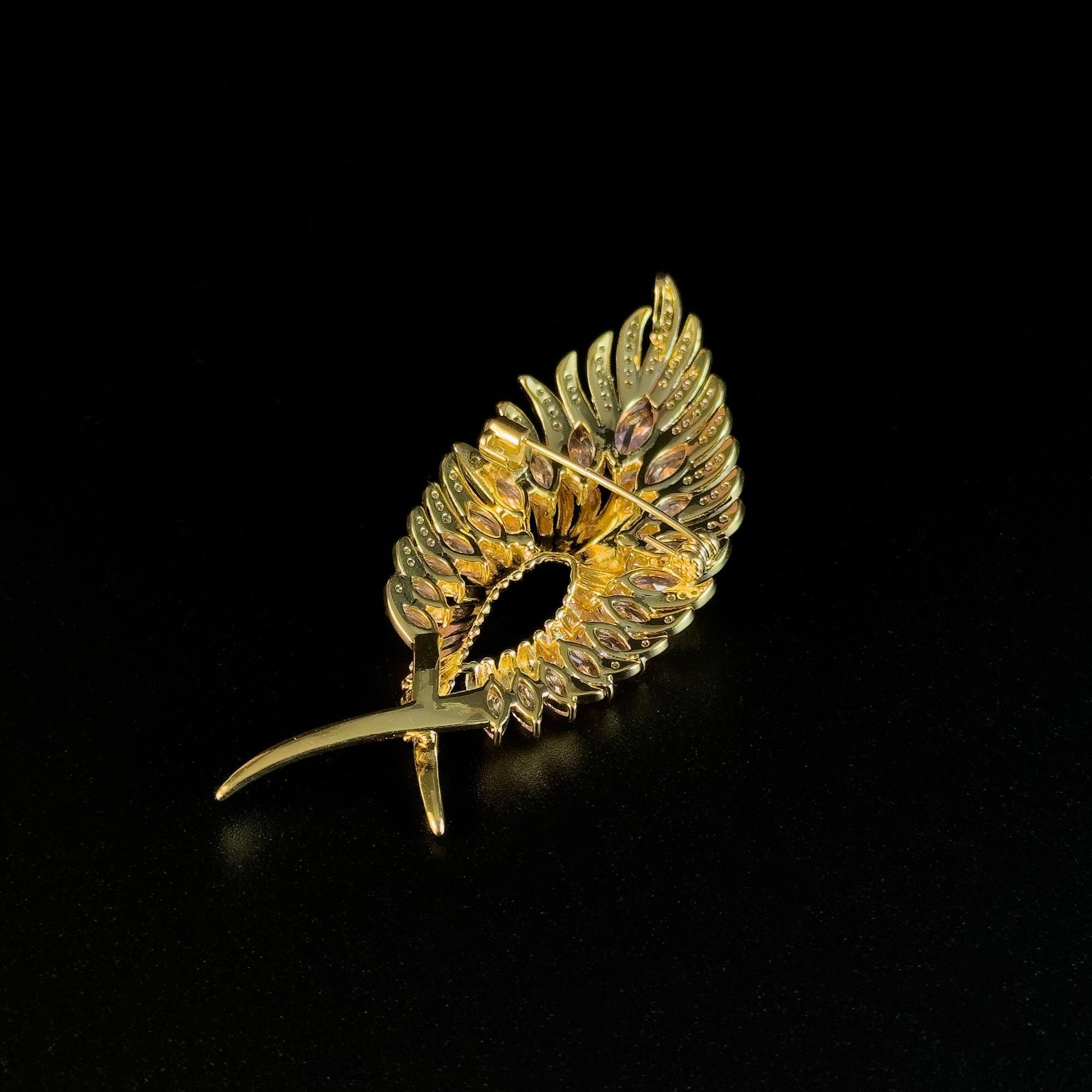 Gold Feather Brooch with Pink Zircon