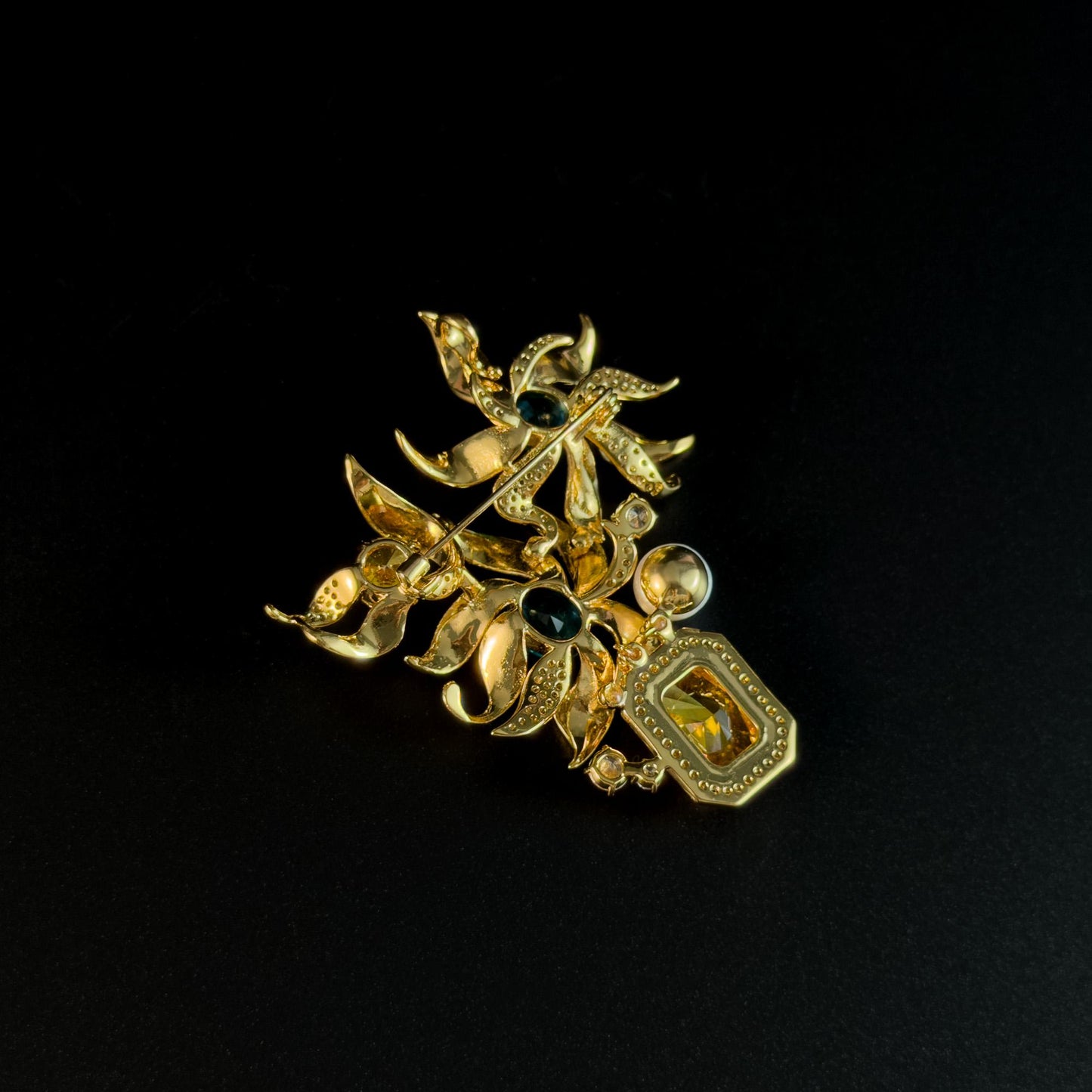 This Gold Vase Brooch Features a Bouquet of Lilies