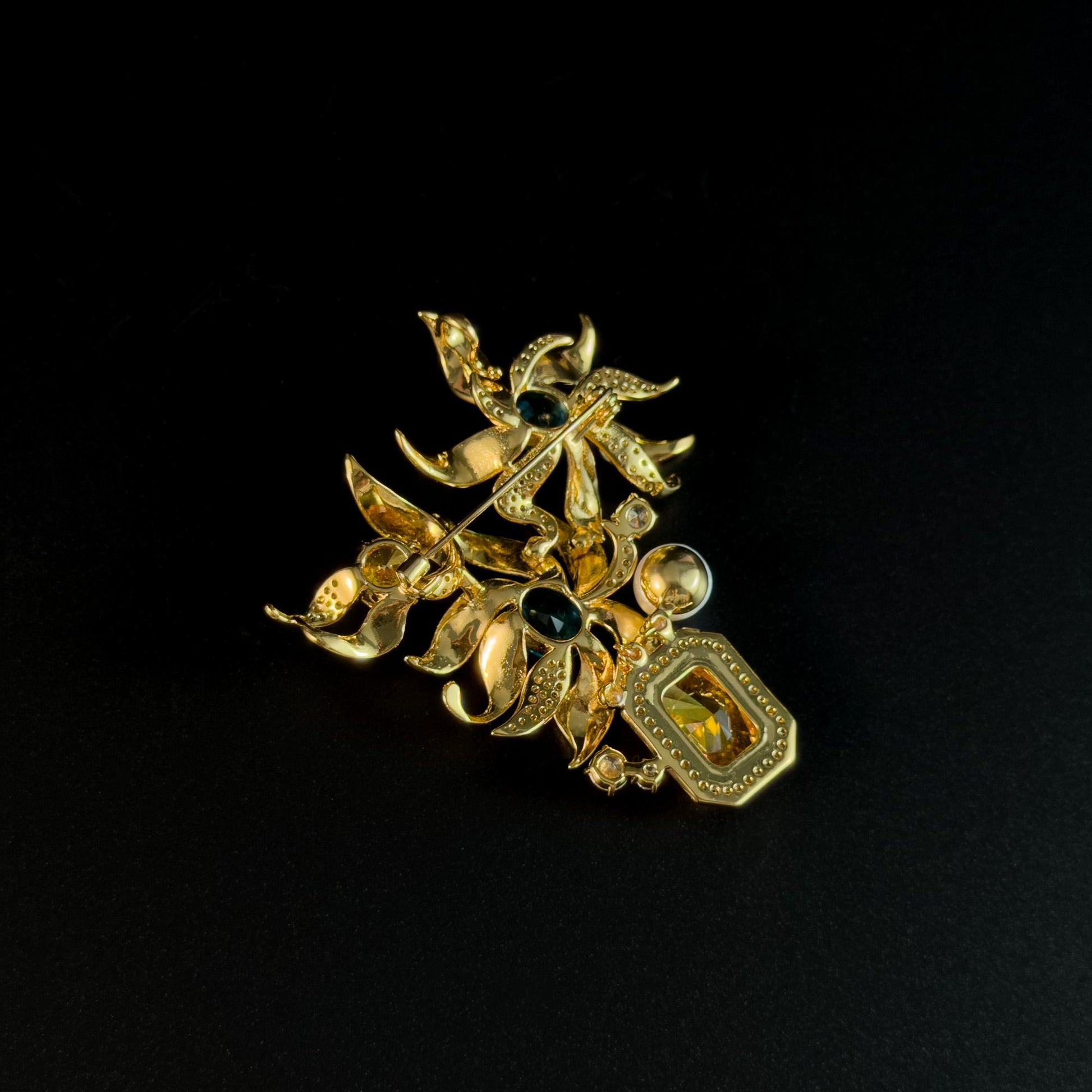 This Gold Vase Brooch Features a Bouquet of Lilies