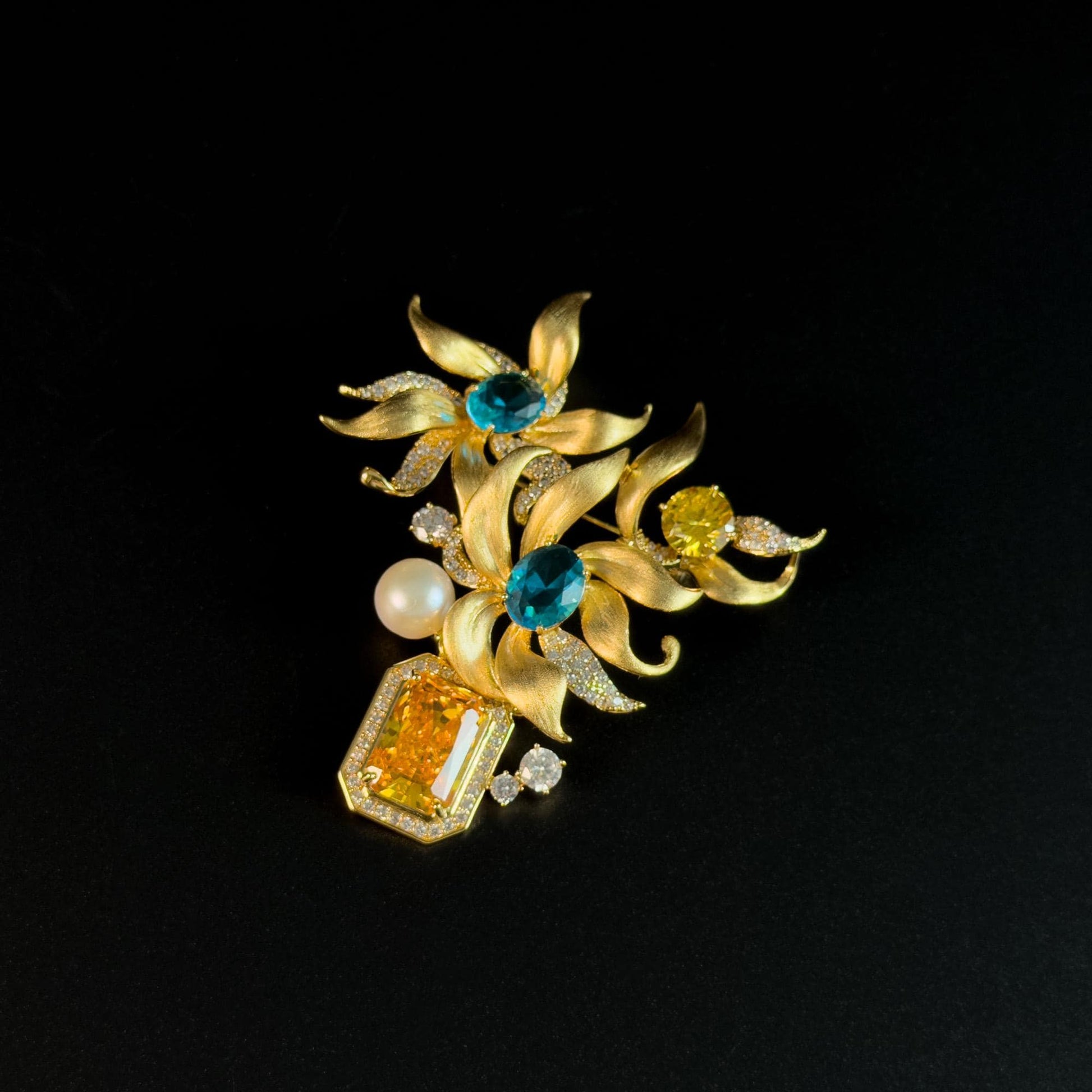 This Gold Vase Brooch Features a Bouquet of Lilies
