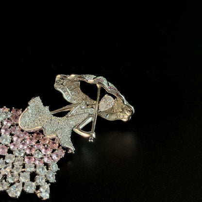 Brooch Featuring a Person Holding an Umbrella