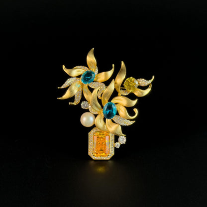 This Gold Vase Brooch Features a Bouquet of Lilies