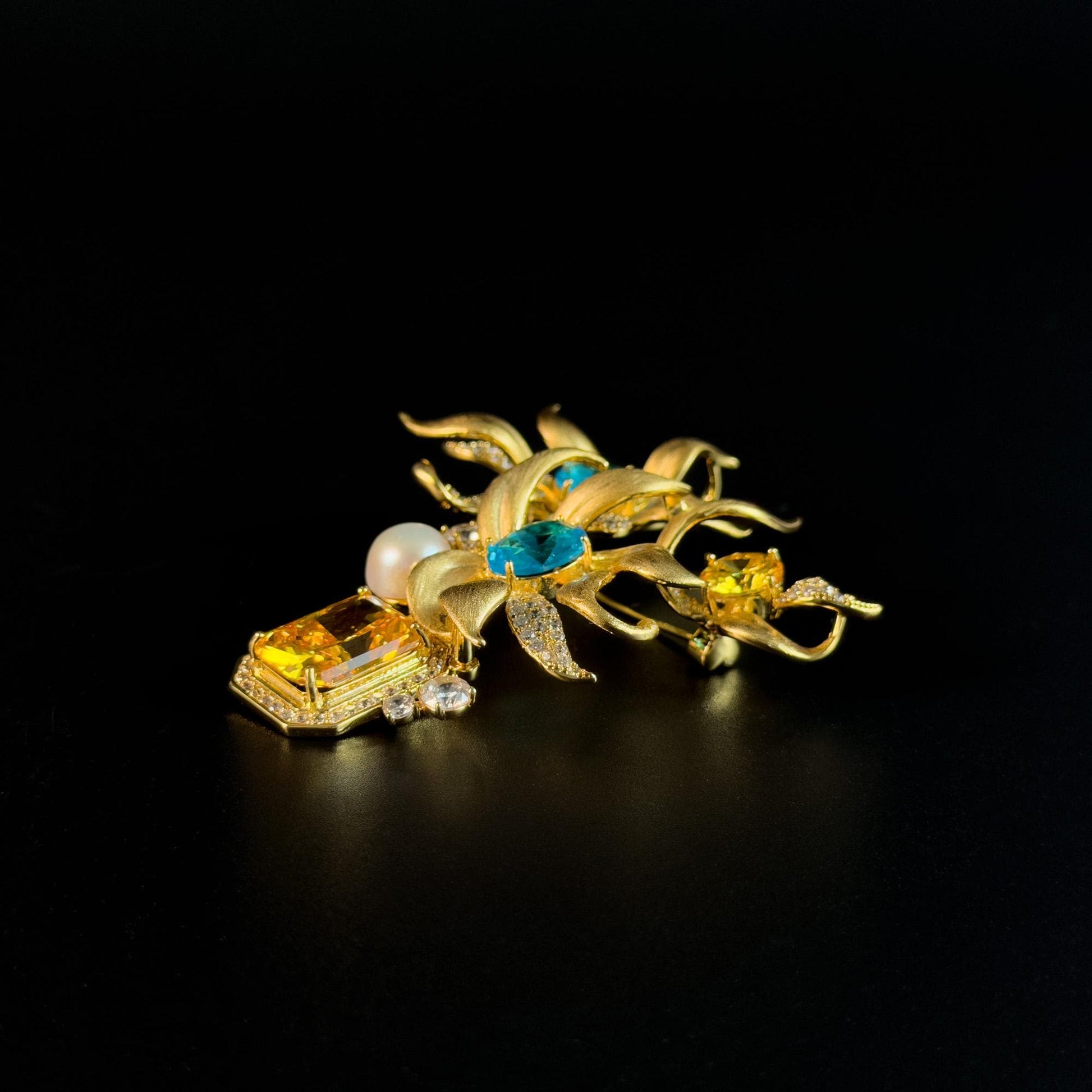 This Gold Vase Brooch Features a Bouquet of Lilies