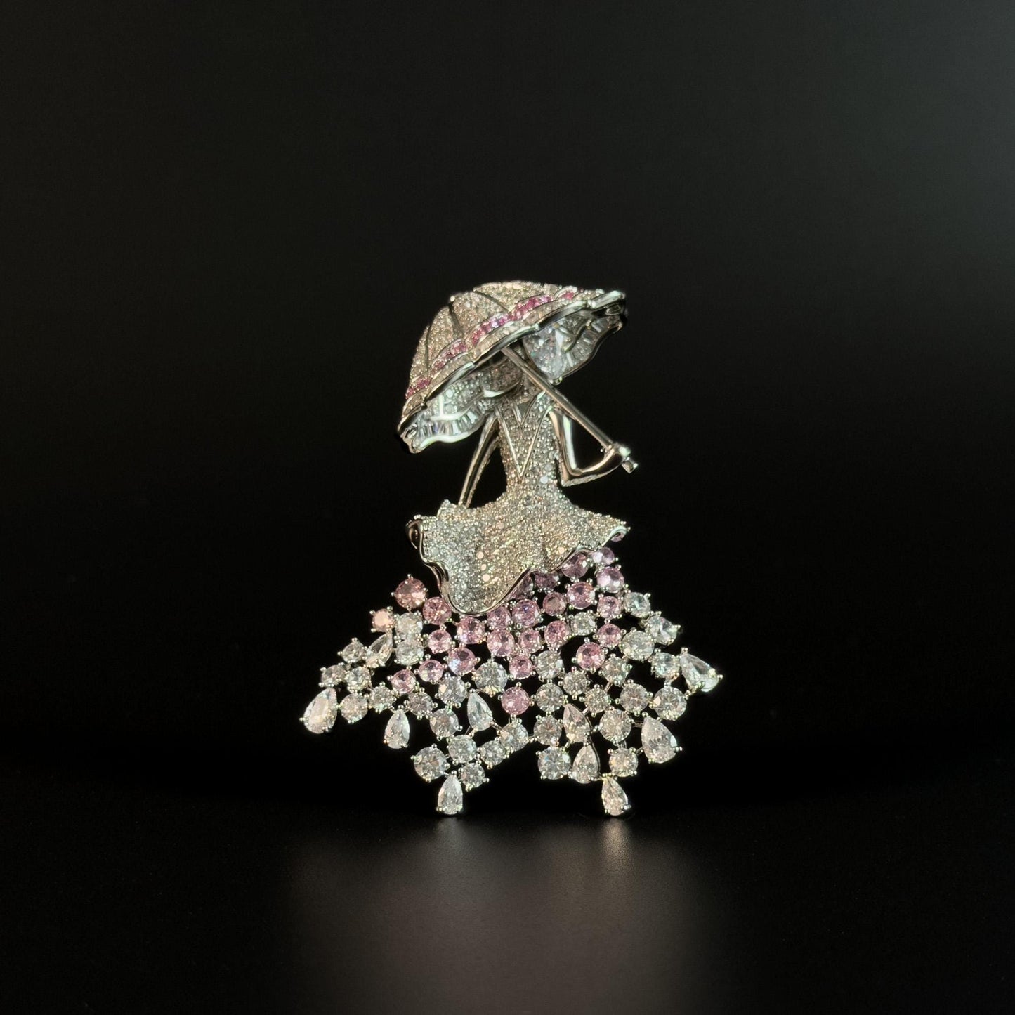 Brooch Featuring a Person Holding an Umbrella
