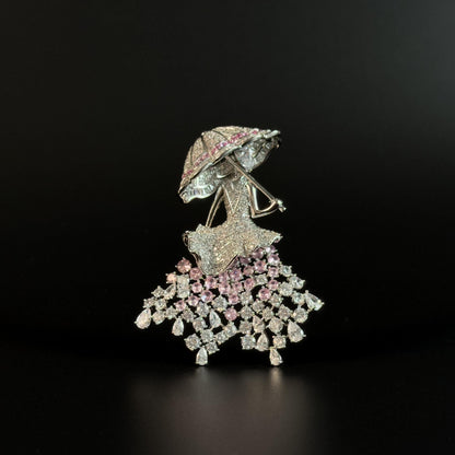 Brooch Featuring a Person Holding an Umbrella