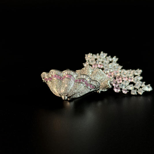 Brooch Featuring a Person Holding an Umbrella