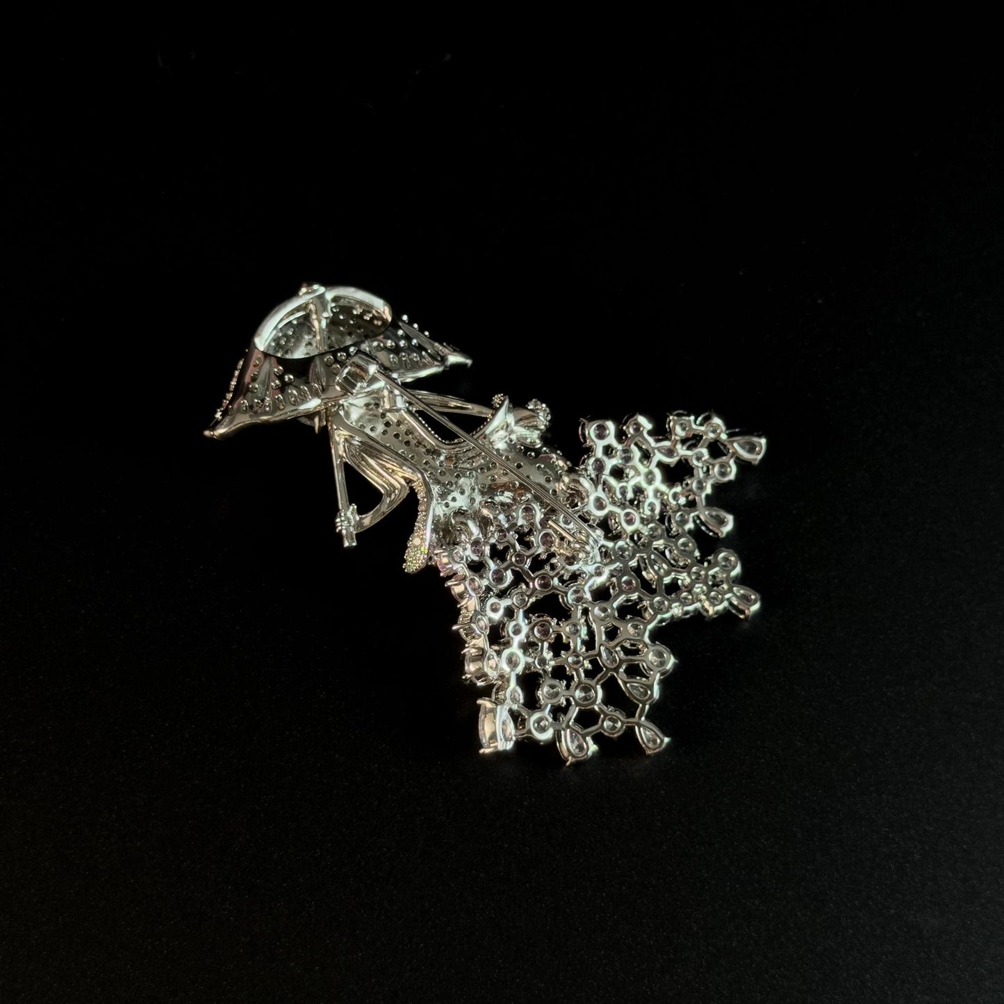Brooch Featuring a Person Holding an Umbrella