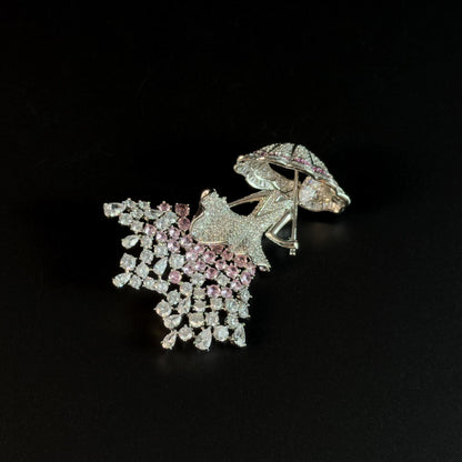 Brooch Featuring a Person Holding an Umbrella