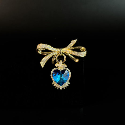 Apollonia · Golden Bow Heart Pendant Brooch