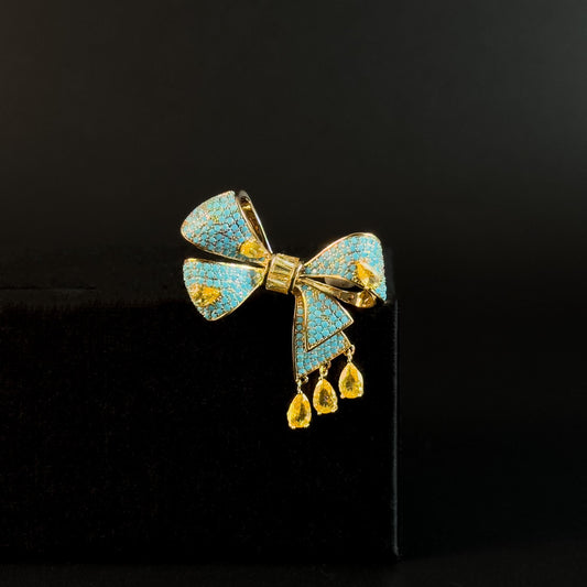 Antigone · Azure Bow Pendant Brooch