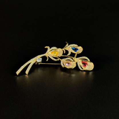 Alope · Golden Peacock Feather Brooch