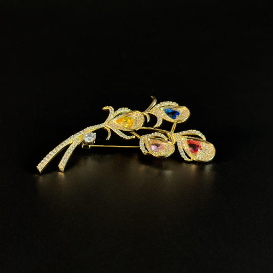 Alope · Golden Peacock Feather Brooch