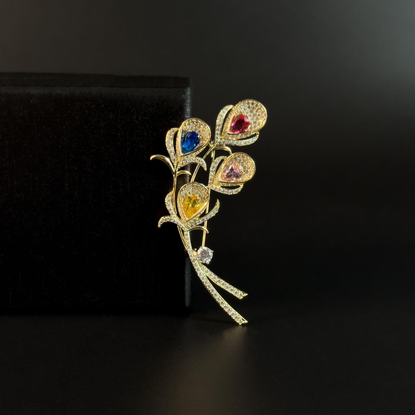Alope · Golden Peacock Feather Brooch