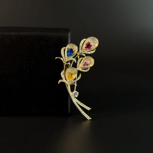 Alope · Golden Peacock Feather Brooch